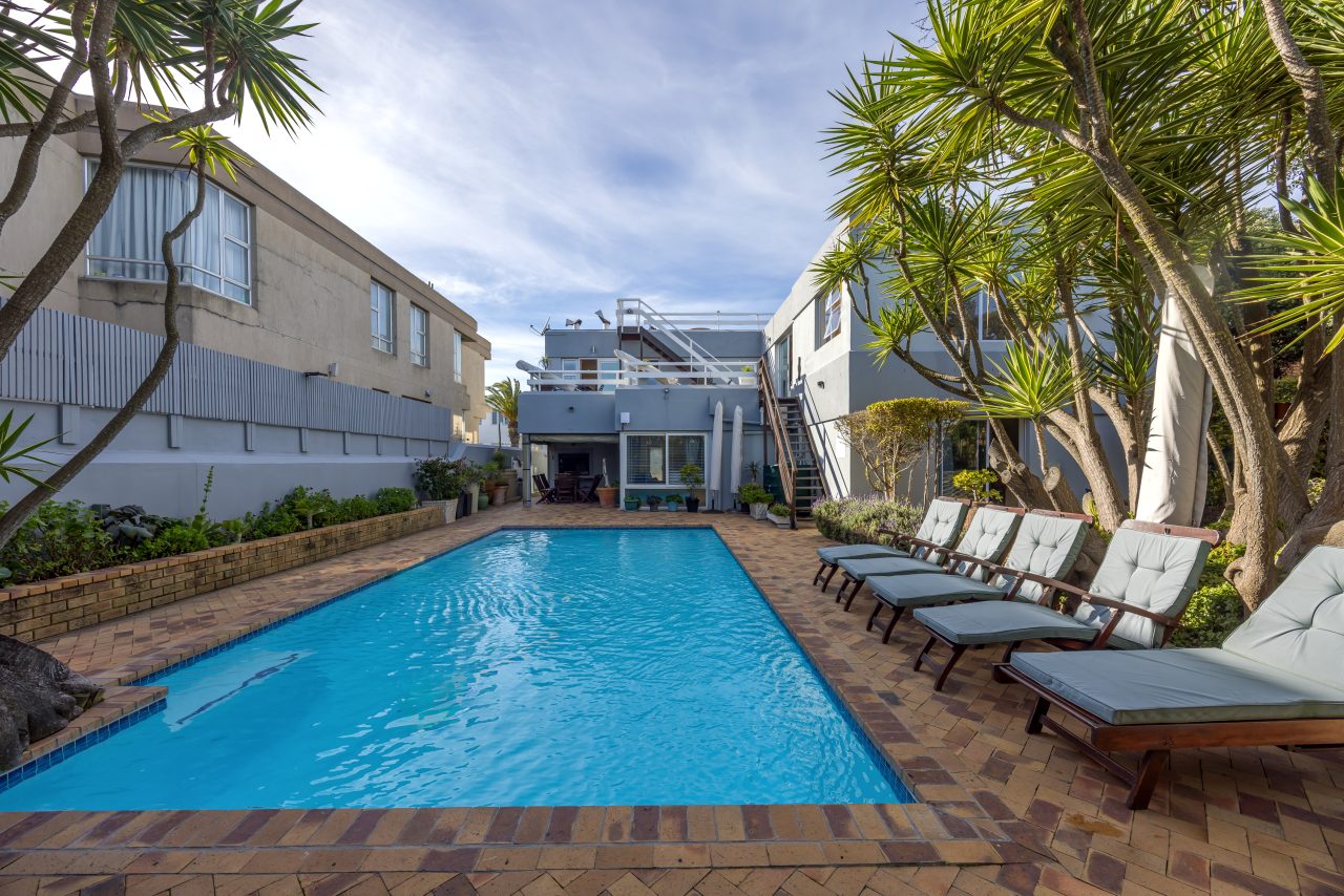Pool and garden at Secret Garden Guesthouse