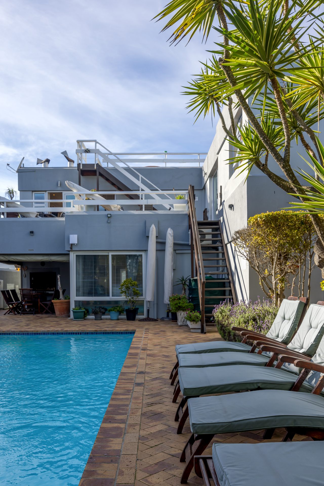 Pool Area at Secret Garden Guesthouse in Bloubergstrand