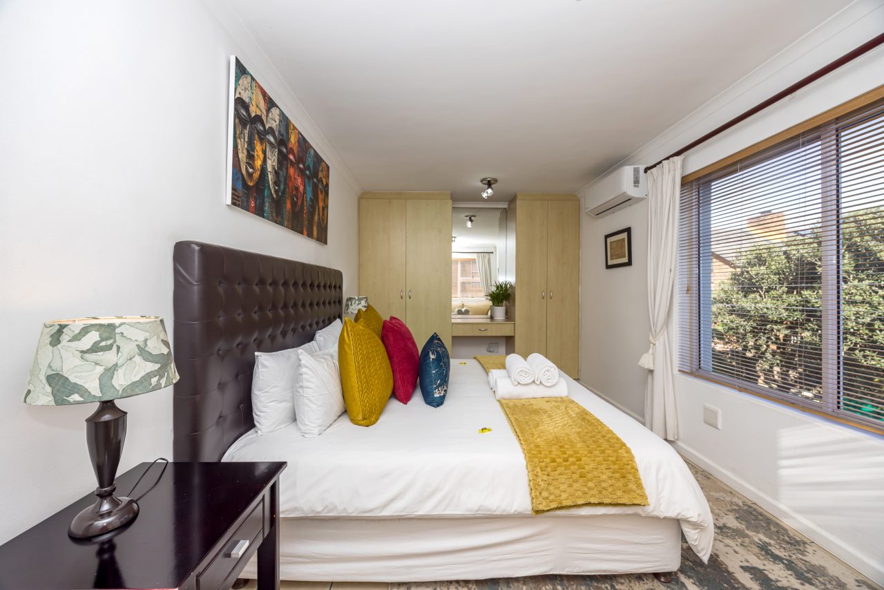 Protea Luxury King Suite with Sofa Bed at Secret Garden Guesthouse
