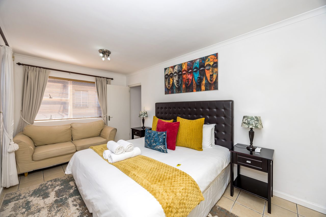 Protea Luxury King Suite with Sofa Bed at Secret Garden Guesthouse
