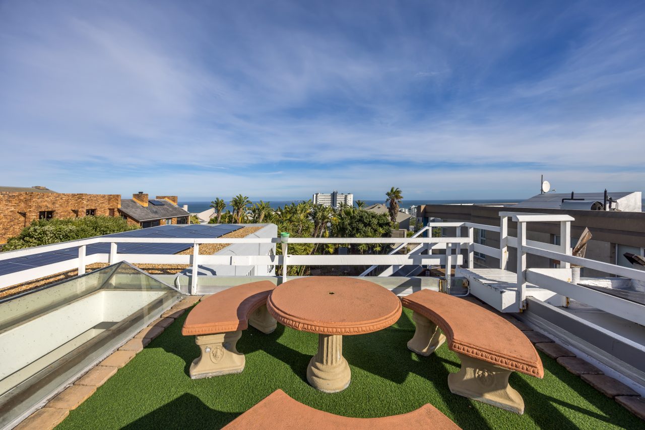Roof terrace seating with views towards the Atlantic